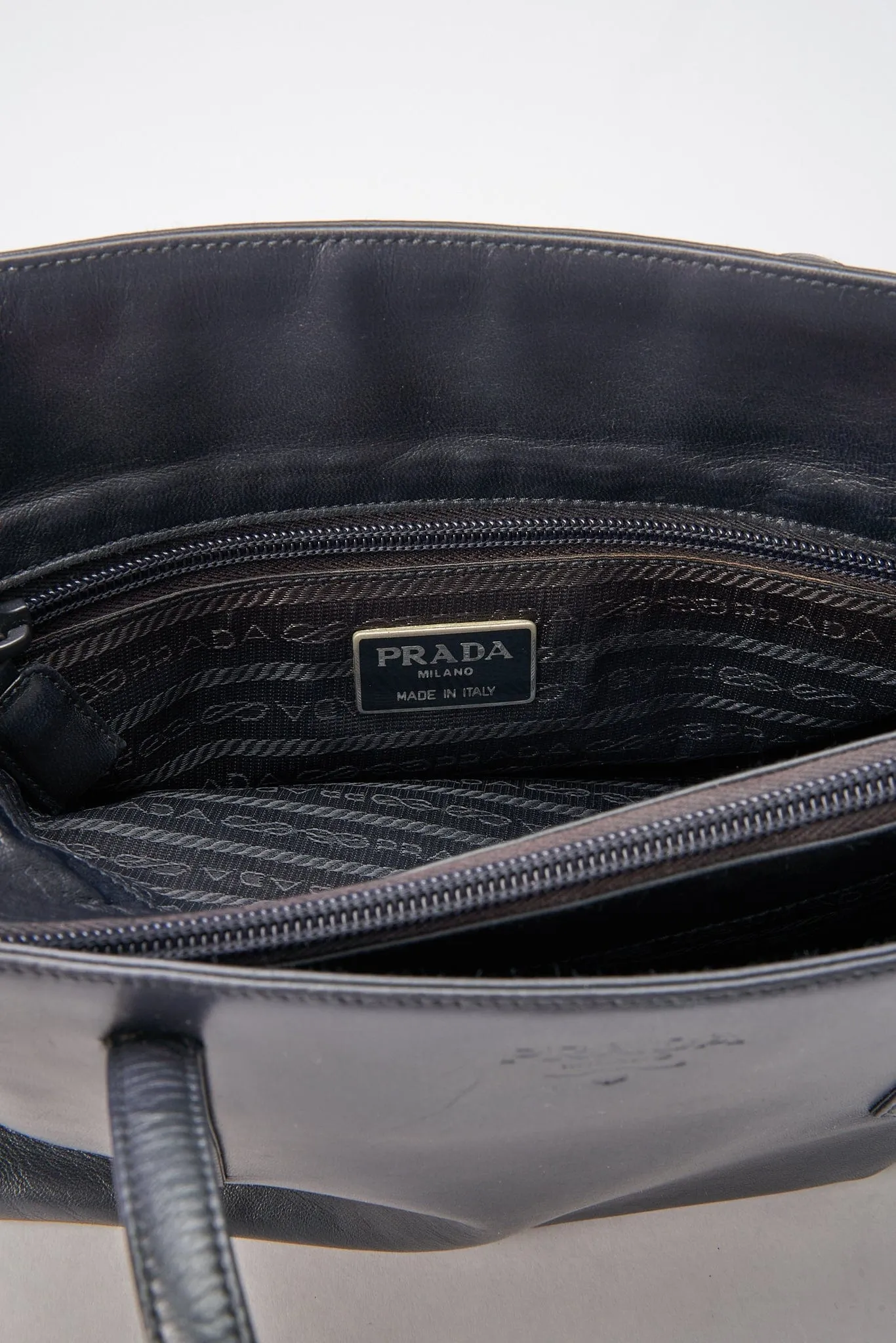 A vintage 90's Prada Navy Leather Shoulder Bag